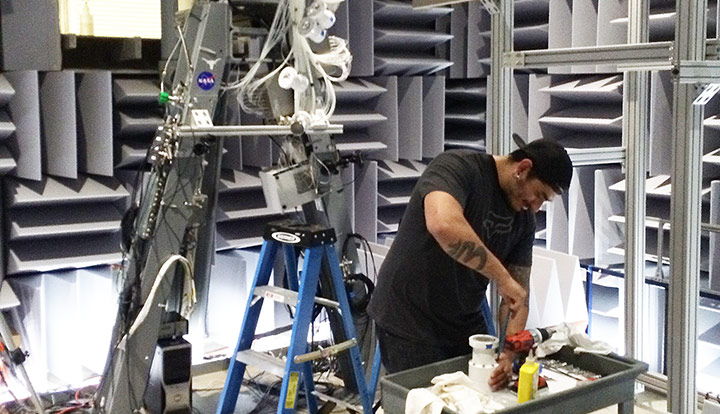 Valdez installing pressure tubing in clustered rocket nozzle